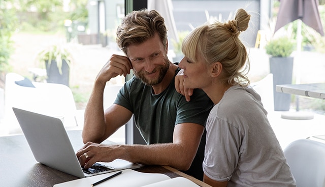 Couple using their laptop