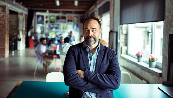 Man leaning on table