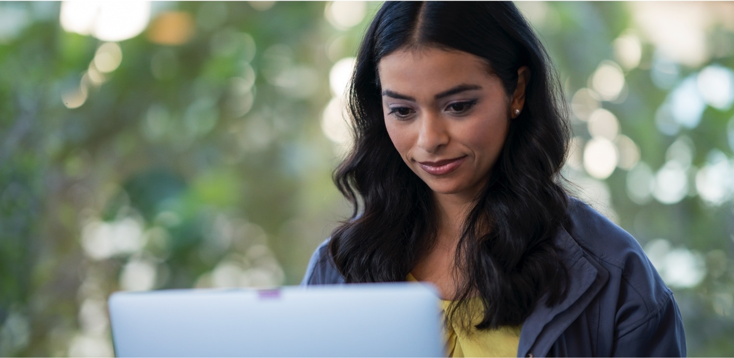 Trader looking at her laptop