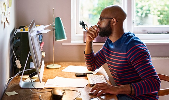 man looking at computer