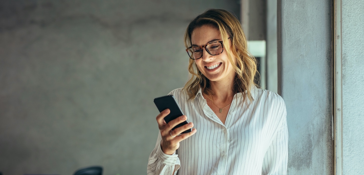 Investor looking at her cell phone